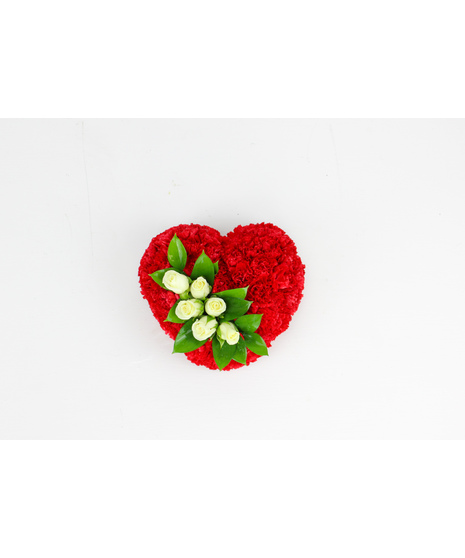 A lovely casket bouquet of white roses enclosed in a heart of red carnations.