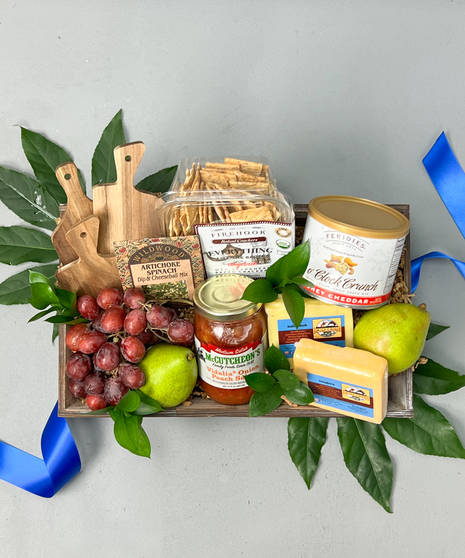 Our Charcuterie Crate features local meat, cheese, and honey with assorted fruit!