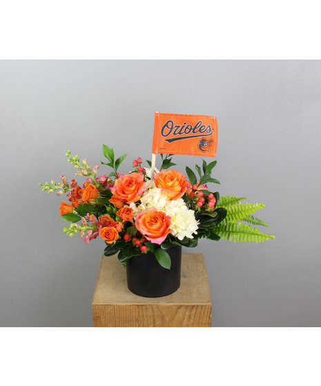 Major League is a bold and spirited floral arrangement that proudly celebrates the Baltimore Orioles with its dynamic blend of team-inspired hues.