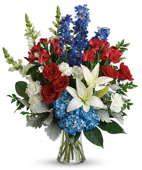 A patriotic bouquet of long lasting red, white and blue blooms. 