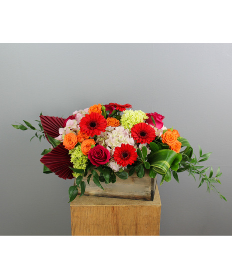 Crimson Sunrise is a bold and captivating floral arrangement designed to evoke the warmth and brilliance of a sunrise.