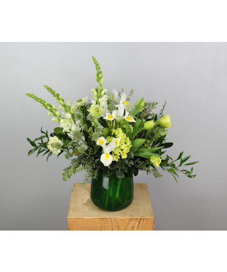 A graceful nod to new beginnings and heartfelt journeys, this arrangement blooms with the gentle warmth of spring.